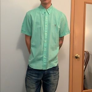 A large mint green polo button down